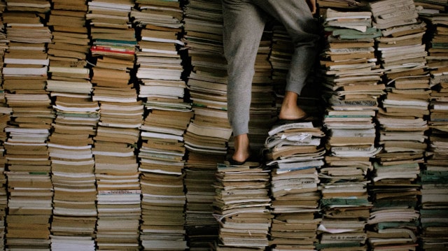 person standing on books